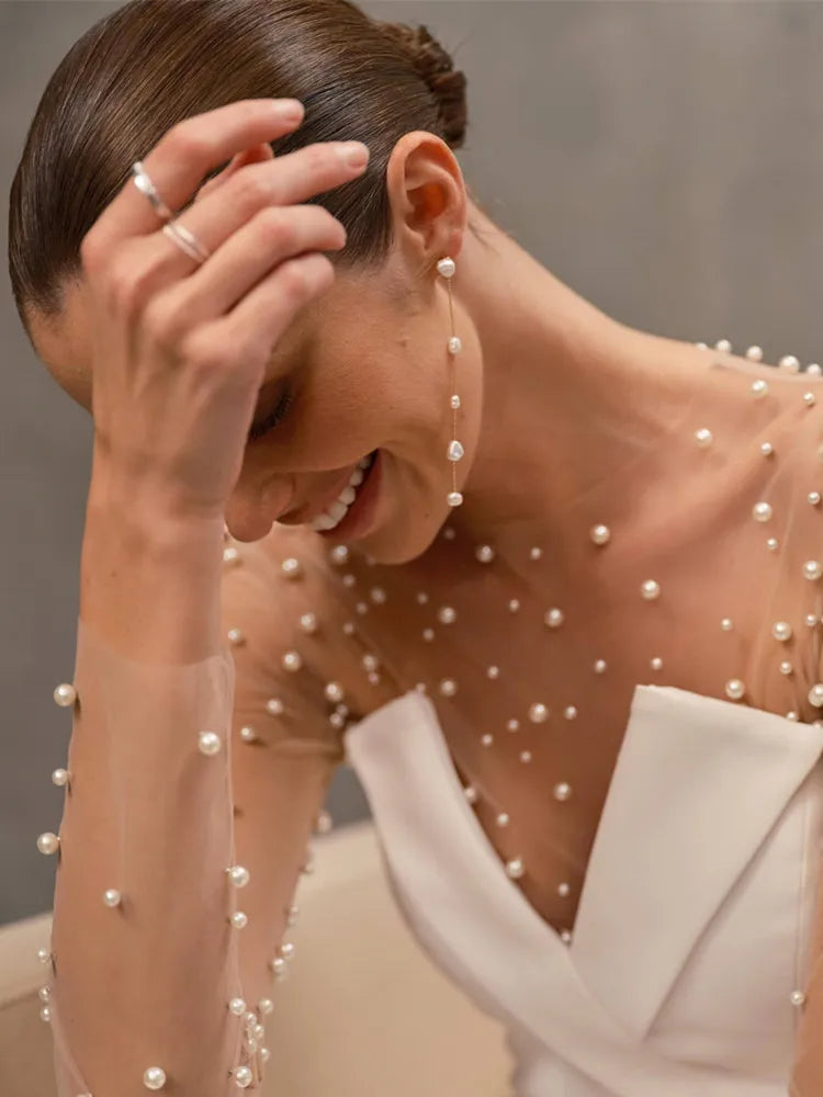 Pearl White Long Sleeve Bodycon Jumpsuit with Flare Pants VestiVogue